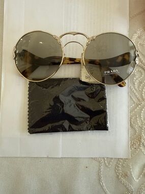 Prada Gold Frame Round Sunglasses with Tortoiseshell Temples and Gray Lenses